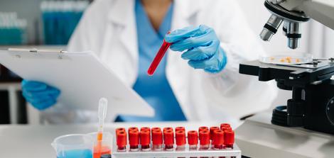 researcher with blood samples