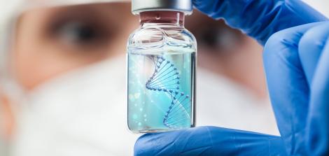 doctor holding medication bottle with DNA helix inside