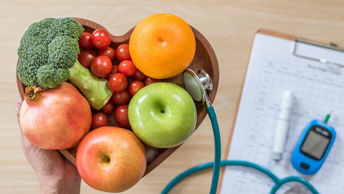 heart shaped bowl with fruits and vegetables