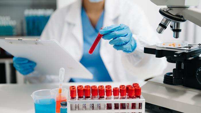 researcher with blood samples