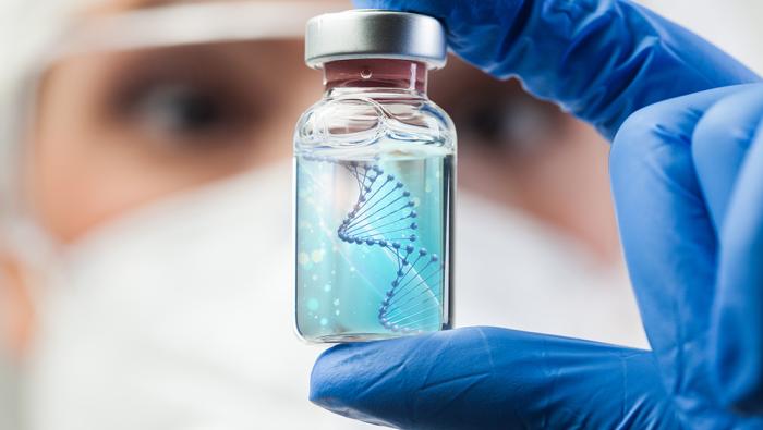 doctor holding medication bottle with DNA helix inside